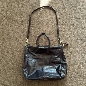 HOBO black with brown stitching crossbody adjustable strap purse.  Gently used